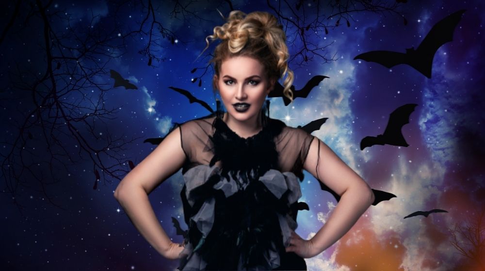 woman wearing a diy halloween costume with bats in the background | 10 DIY Plus Size Halloween Costumes You Can Sew | featured