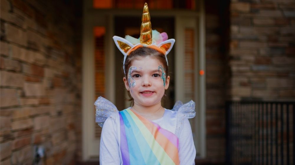 Toddler in Unicorn Costume | 11 Unicorn Costume Ideas For A Magical Halloween | featured